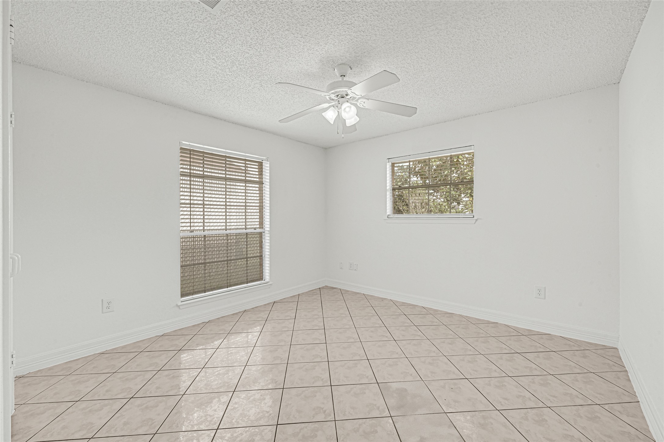 9208 Carousel Lane Houston, TX 77080 - Photo 13 of 31 a view of an empty room with a window
