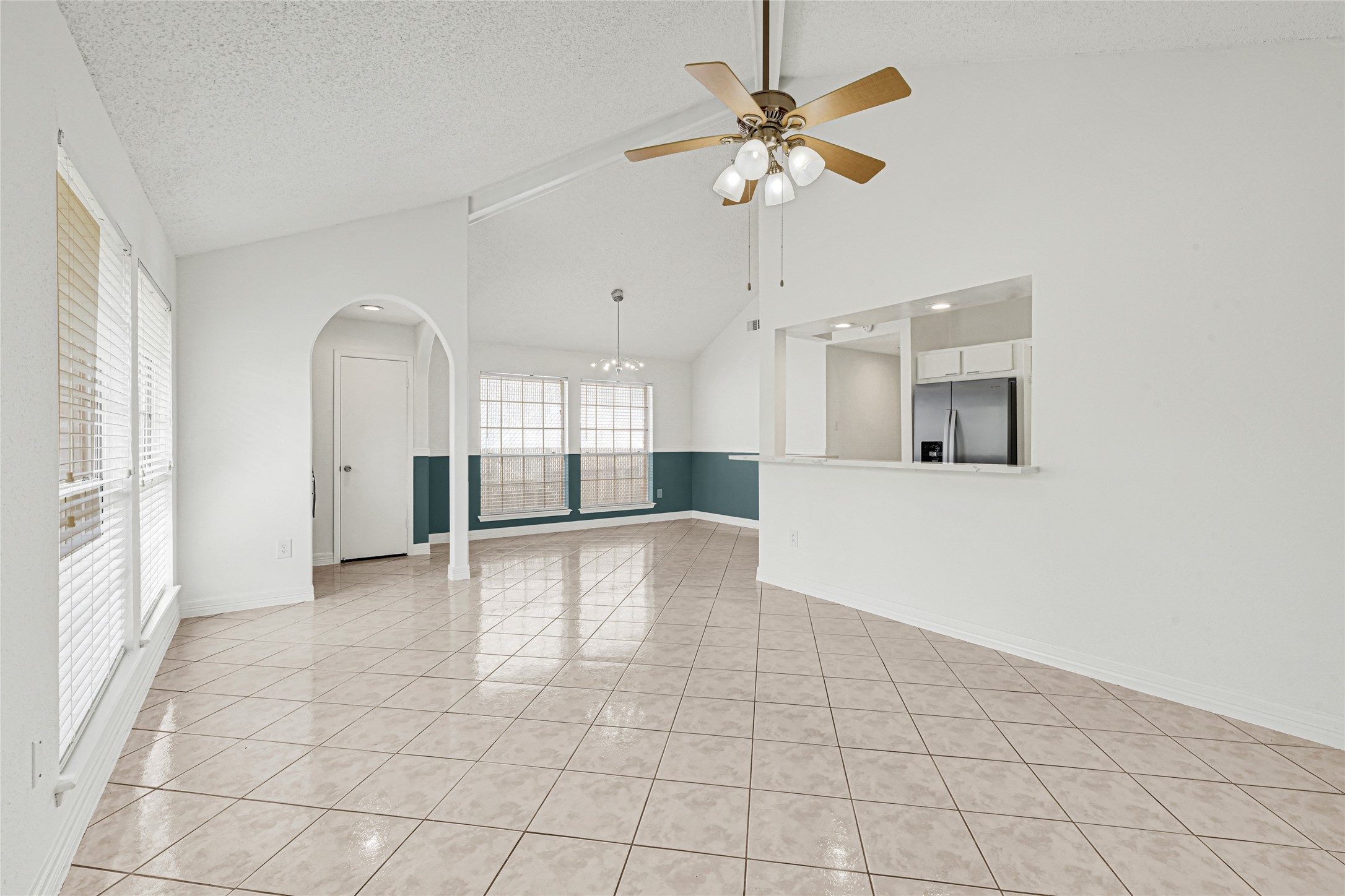 9208 Carousel Lane Houston, TX 77080 - Photo 20 of 31 a view of a kitchen with a sink and a chandelier fan