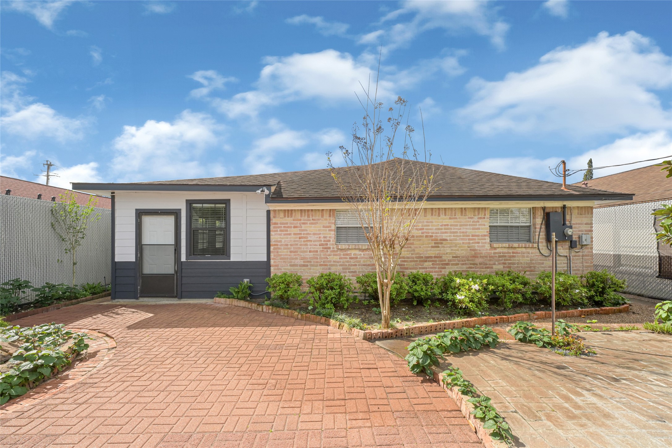9208 Carousel Lane Houston, TX 77080 - Photo 27 of 31 a front view of a house with a yard and garage