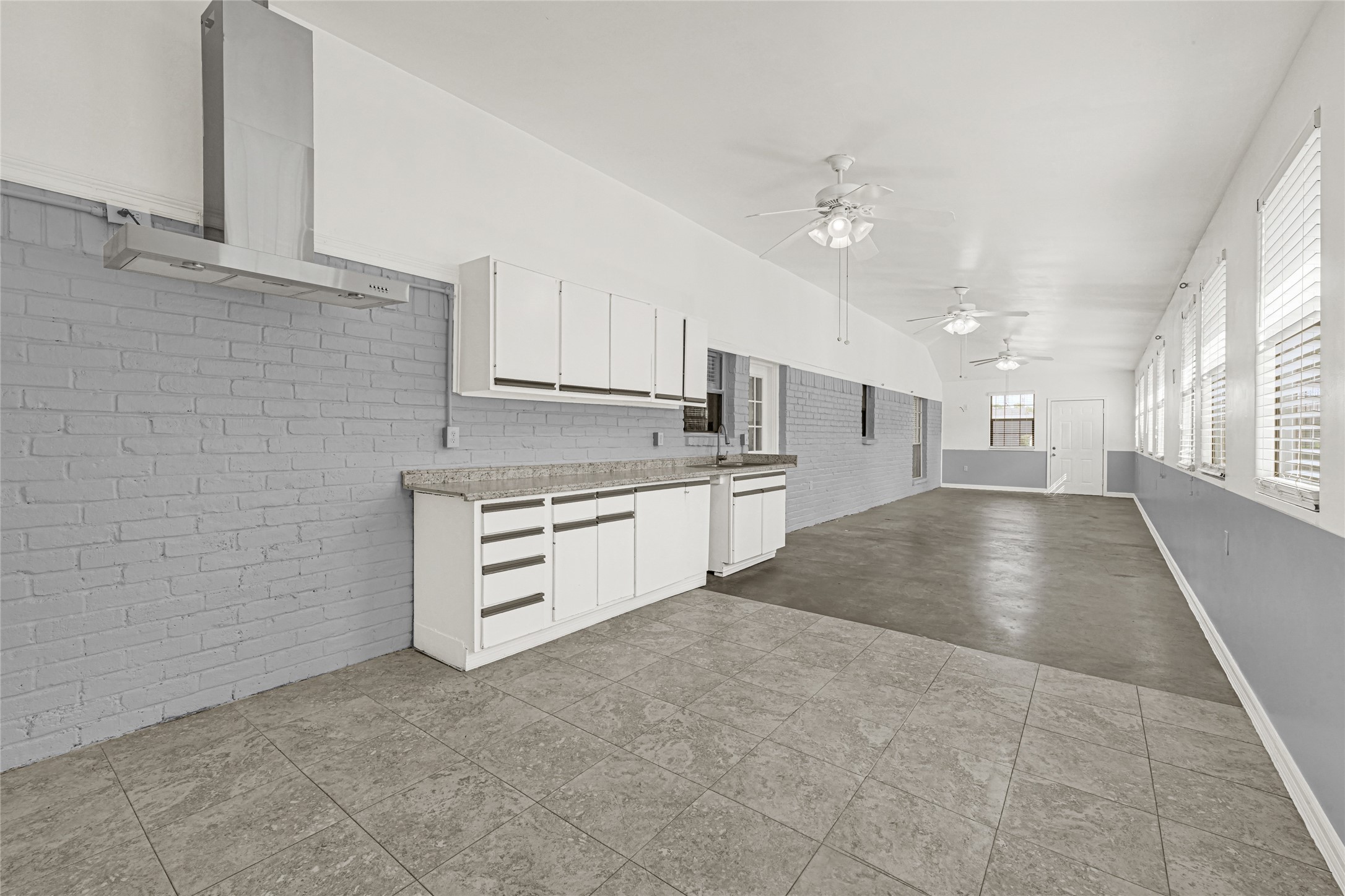 9208 Carousel Lane Houston, TX 77080 - Photo 8 of 31 a kitchen with stainless steel appliances granite countertop a stove a sink and white cabinets