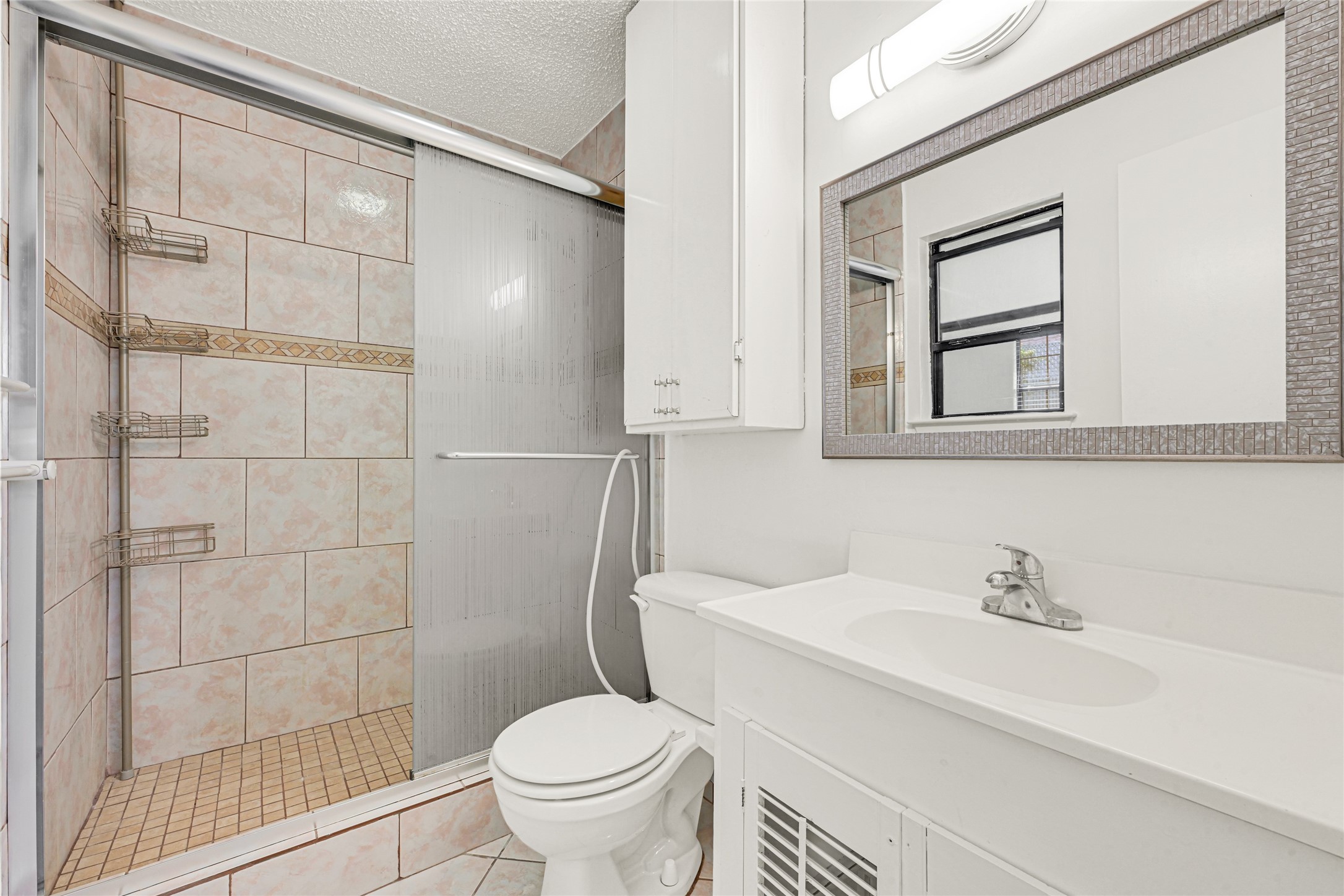 9208 Carousel Lane Houston, TX 77080 - Photo 10 of 31 a white toilet sitting next to a bathroom sink