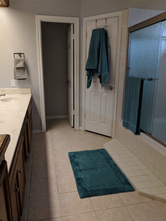 14834 La Rana Drive Houston, TX 77083 - Photo 14 of 14 Bathroom with dual sinks, walk-in glass shower, and ample storage.