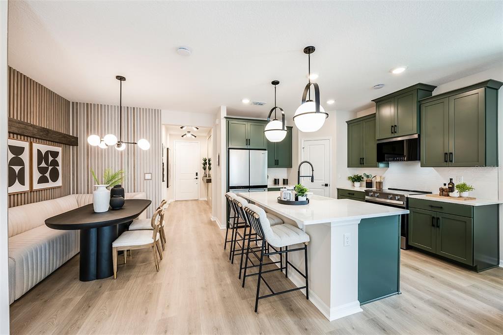 663 Clark Street Oviedo, FL 32765 - Photo 4 of 9 a large kitchen with a table and chairs