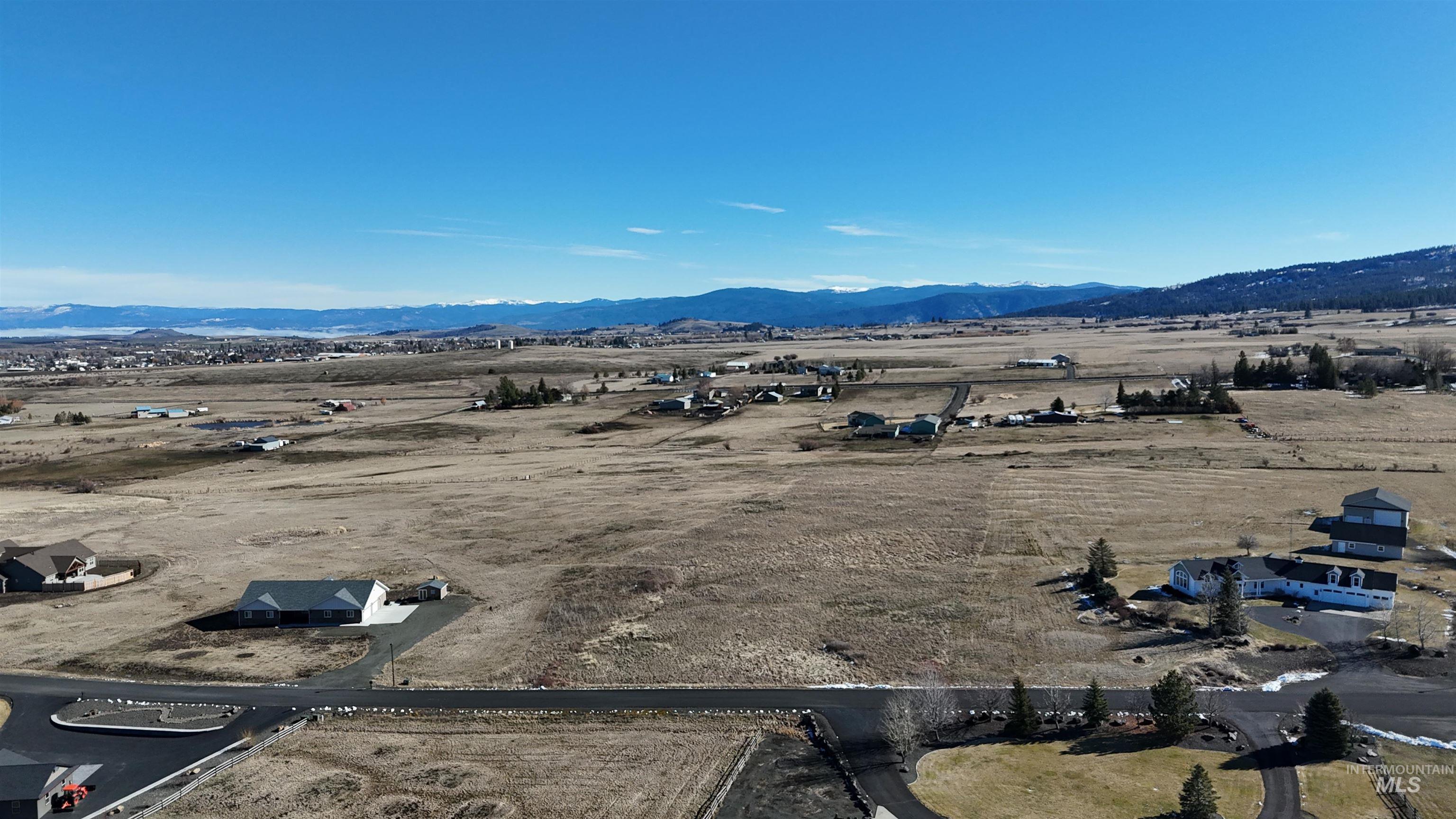 243 Ridgeview Drive Grangeville, ID 83530 - Photo 5 of 9 Overview of rural landscape featuring a mountain backdrop and nearby suburban area