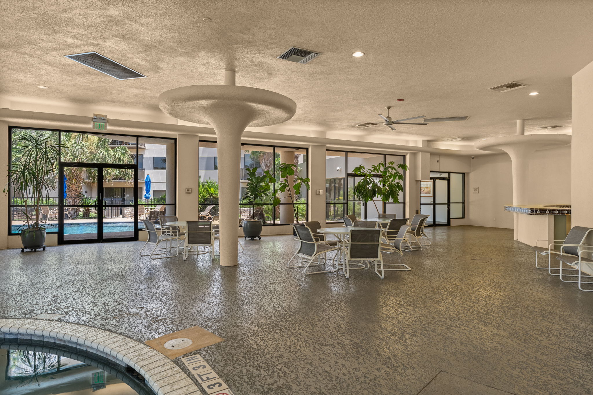 40 North Interstate Highway 35, Unit 11B2 Austin, TX 78701 - Photo 21 of 28 An inviting indoor recreation area with ample seating offers direct views of the outdoor swimming pool.