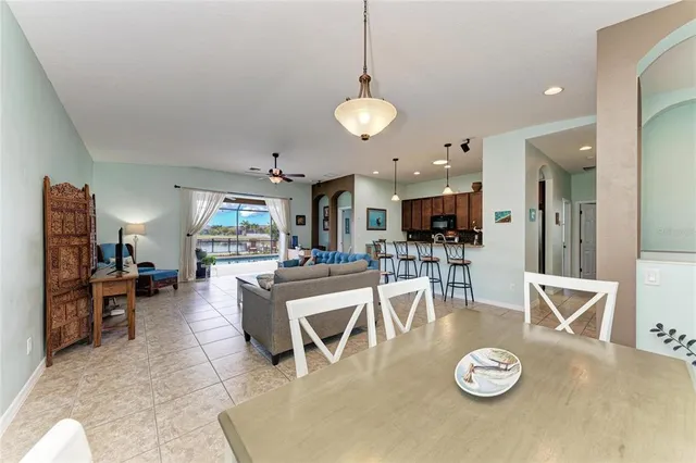 a kitchen with stainless steel appliances granite countertop a sink a stove and a refrigerator