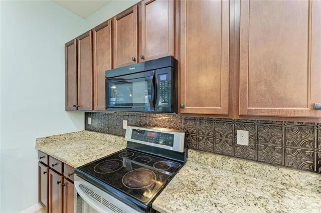a bedroom with a bed and dresser with mirror