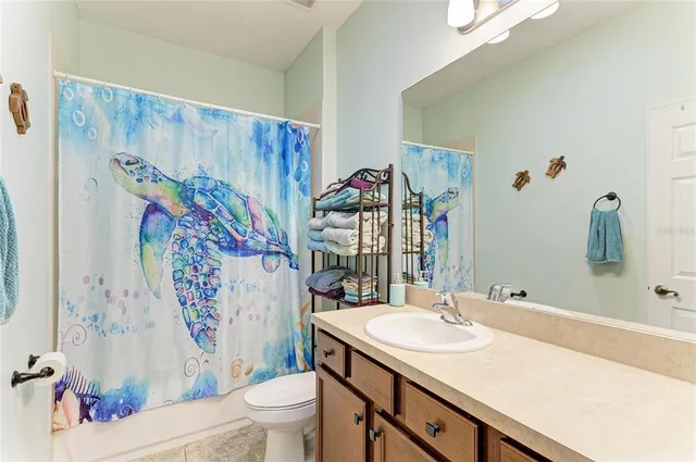 a kitchen with a sink a counter top space and a wooden floor