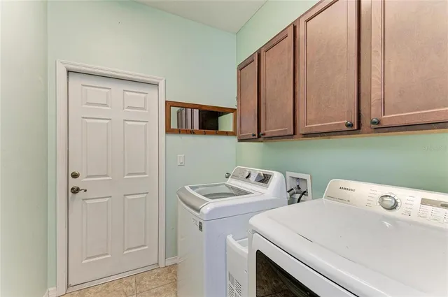 a view of a patio with iron fence