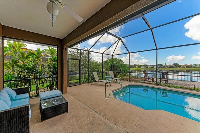 a view of a lake with houses in the background