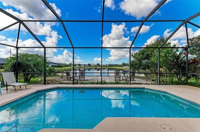 an aerial view of residential houses with outdoor space and street view