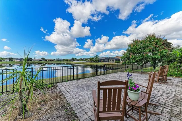an aerial view of a house with a yard basket ball court and outdoor seating