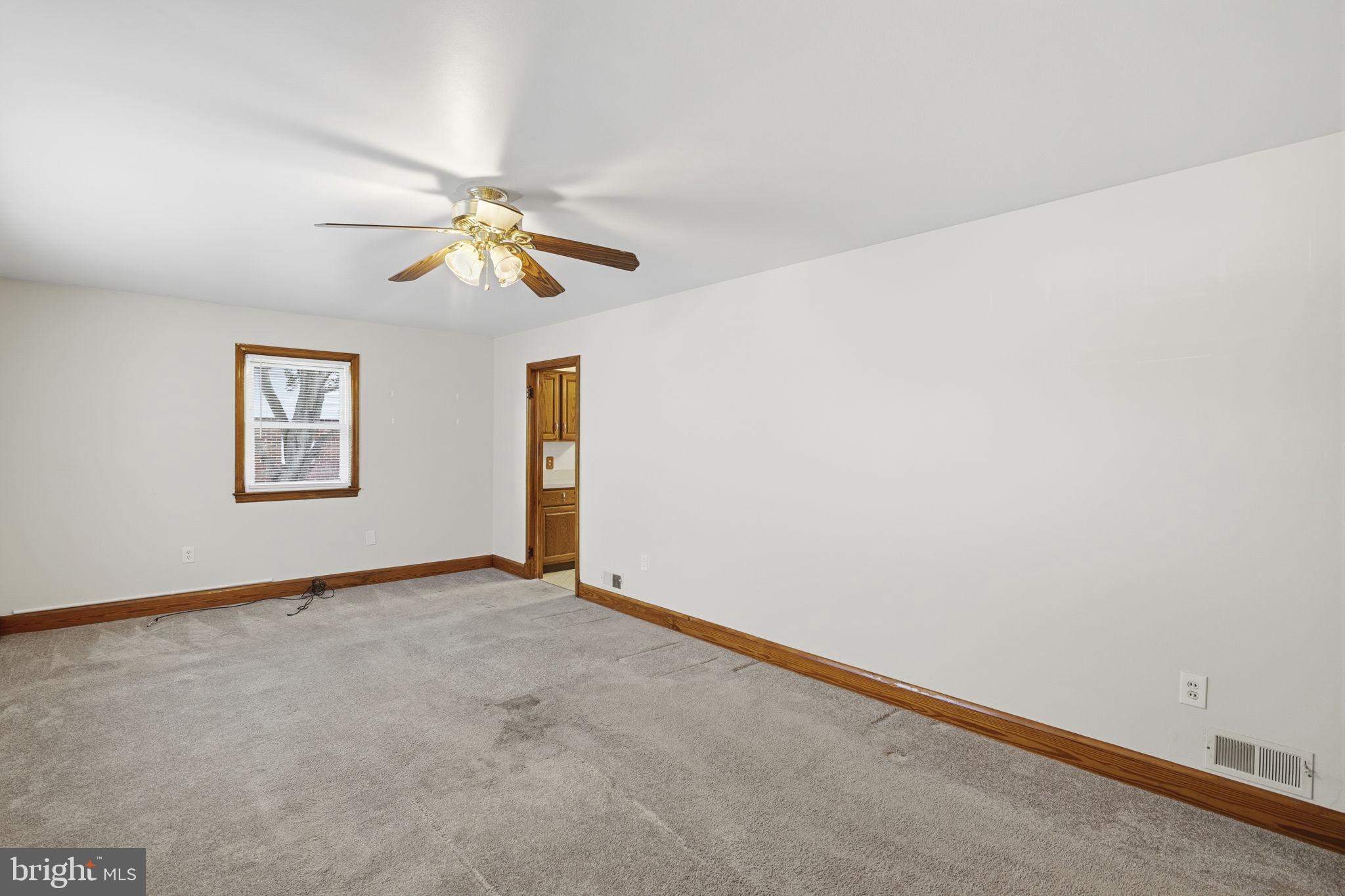 4 Brooks Road Bel Air, MD 21014 - Photo 4 of 21 Living room with wood trim