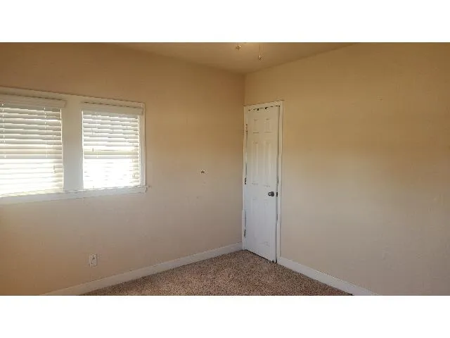 a black and white photo of a living room