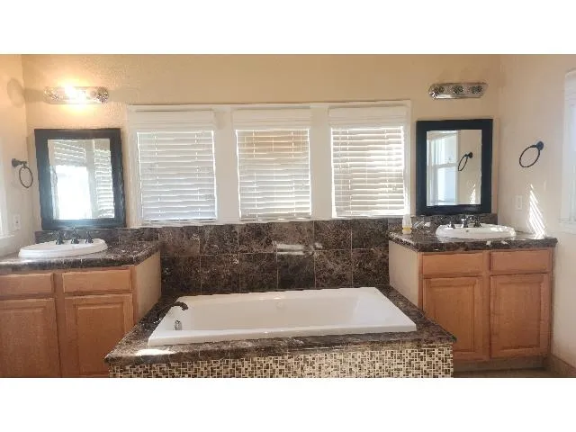 a bathroom with a toilet a sink and shower