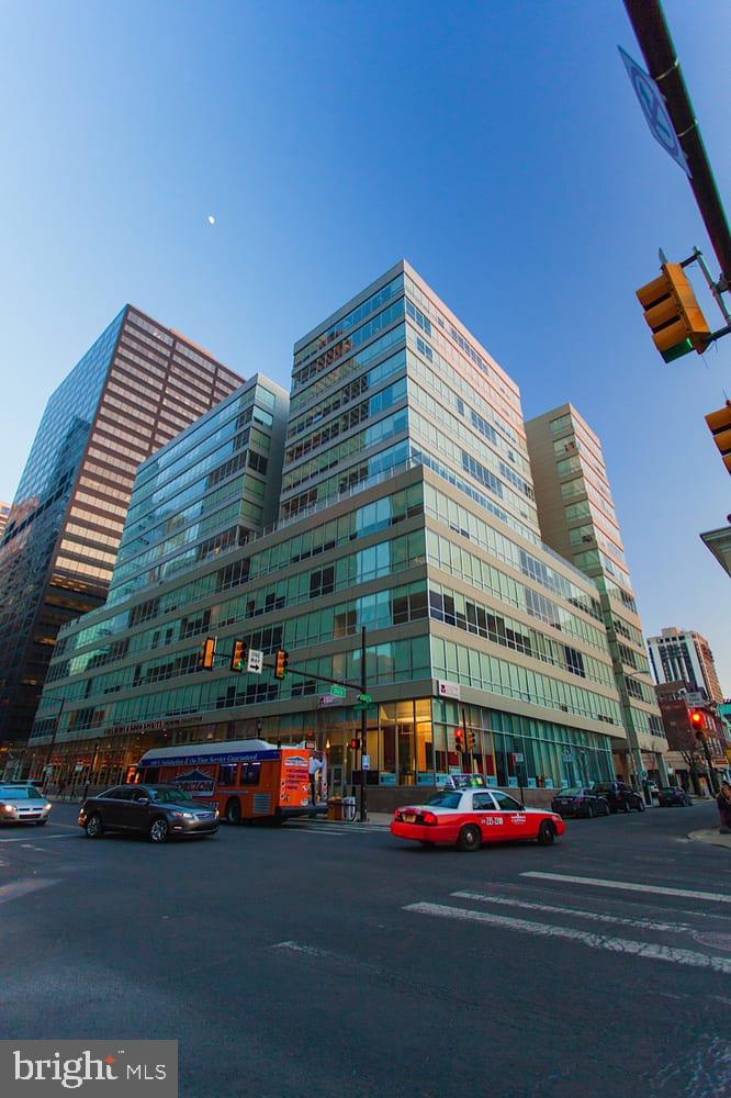 2040 Market Street, Unit 312 Philadelphia, PA 19103 - Photo 12 of 12 a tall building sitting next to a road
