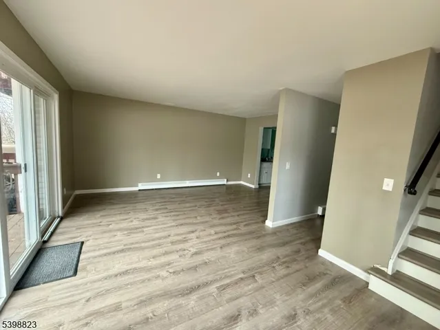 a bathroom with a sink mirror and toilet