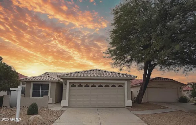 a front view of a house with a garage