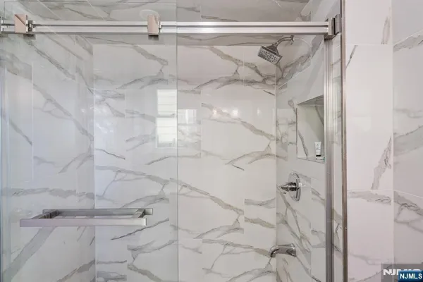 a bedroom with a bed and a chair