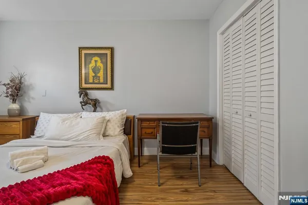 a bedroom with a bed and a dresser