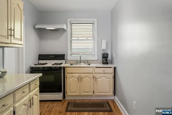 a bathroom with a shower and a sink