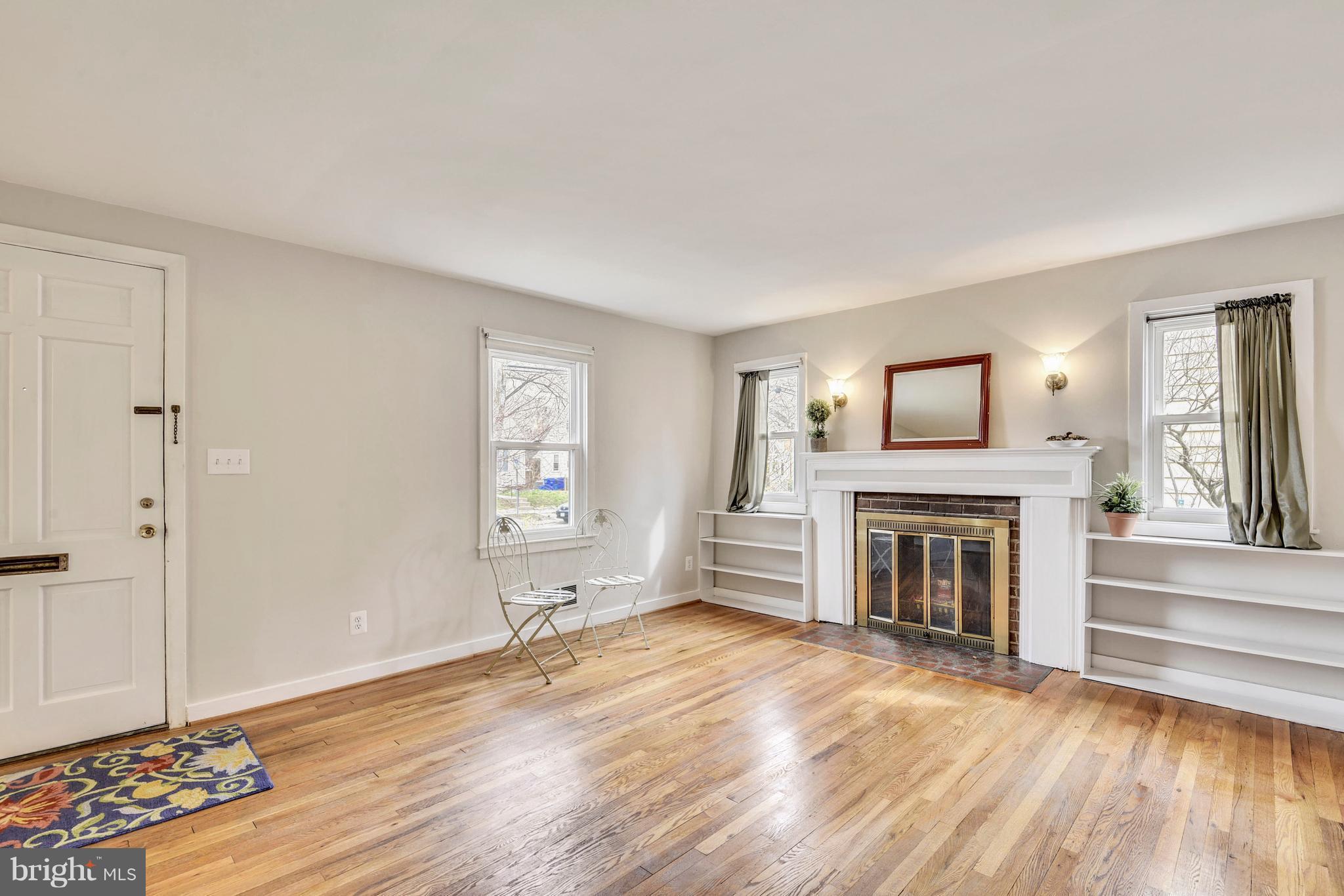 3522 Nimitz Road Kensington, MD 20895 - Photo 12 of 30 Large Room With Hardwood Floors and Fireplace