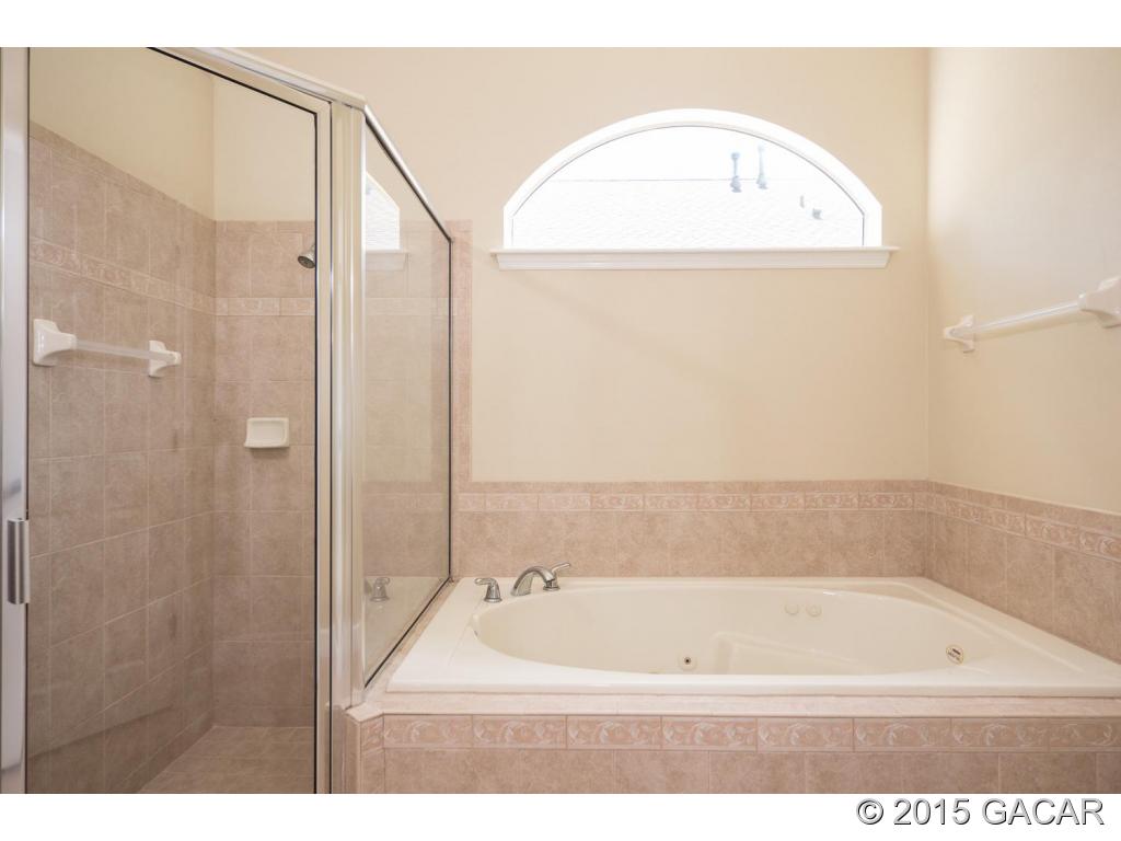 8740 Southwest 25 Road Gainesville, FL 32608 - Photo 16 of 23 Owners Suite bath and shower