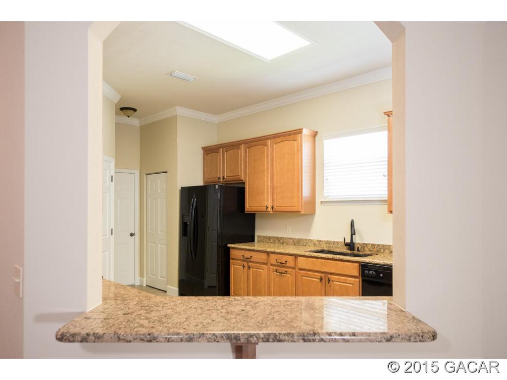 8740 Southwest 25 Road Gainesville, FL 32608 - Photo 8 of 23 Pass through to kitchen