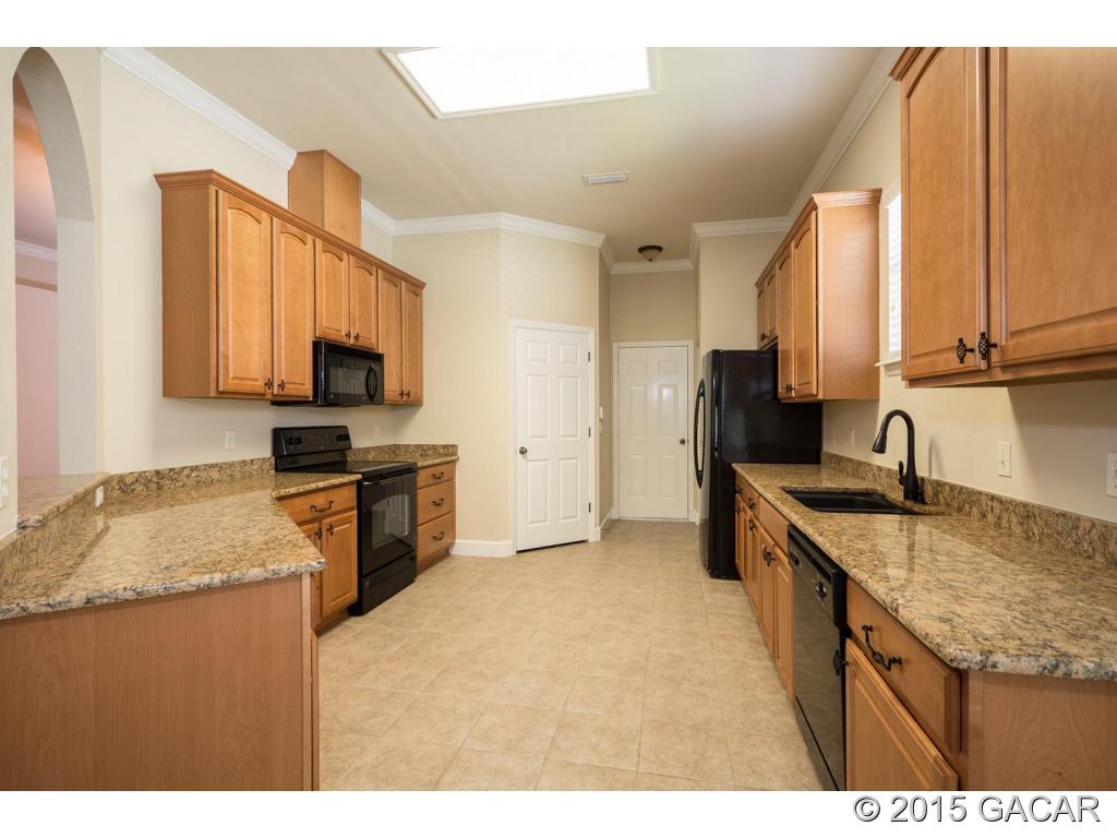 8740 Southwest 25 Road Gainesville, FL 32608 - Photo 9 of 23 Kitchen w/Granite & Upgrades
