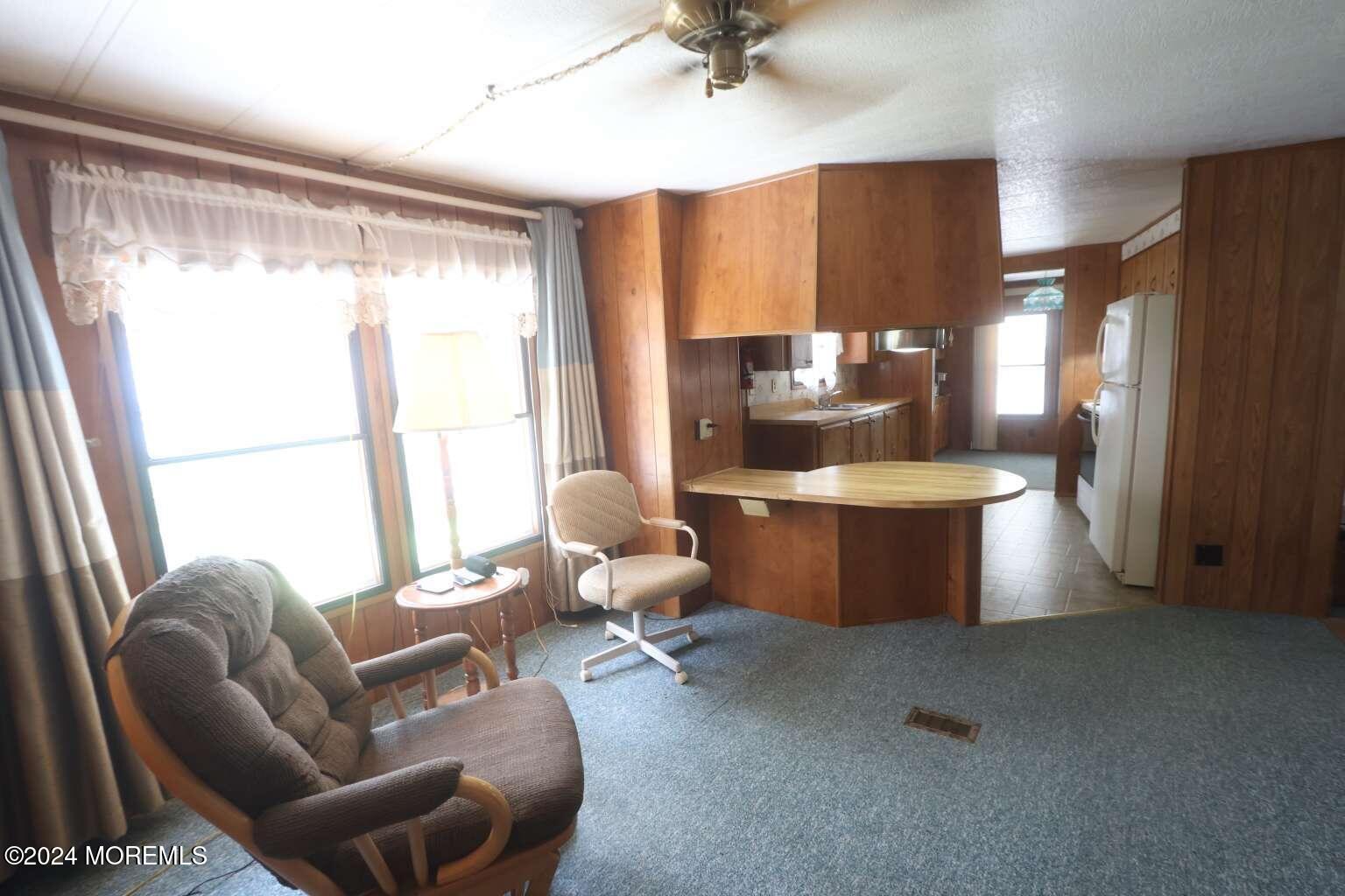 78 Eagle Drive Whiting, NJ 08759 - Photo 13 of 24 a living room with furniture and a large window