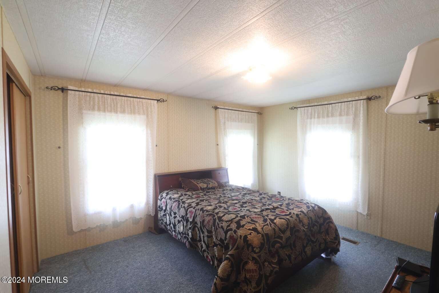 78 Eagle Drive Whiting, NJ 08759 - Photo 17 of 24 a bedroom with a bed and a window