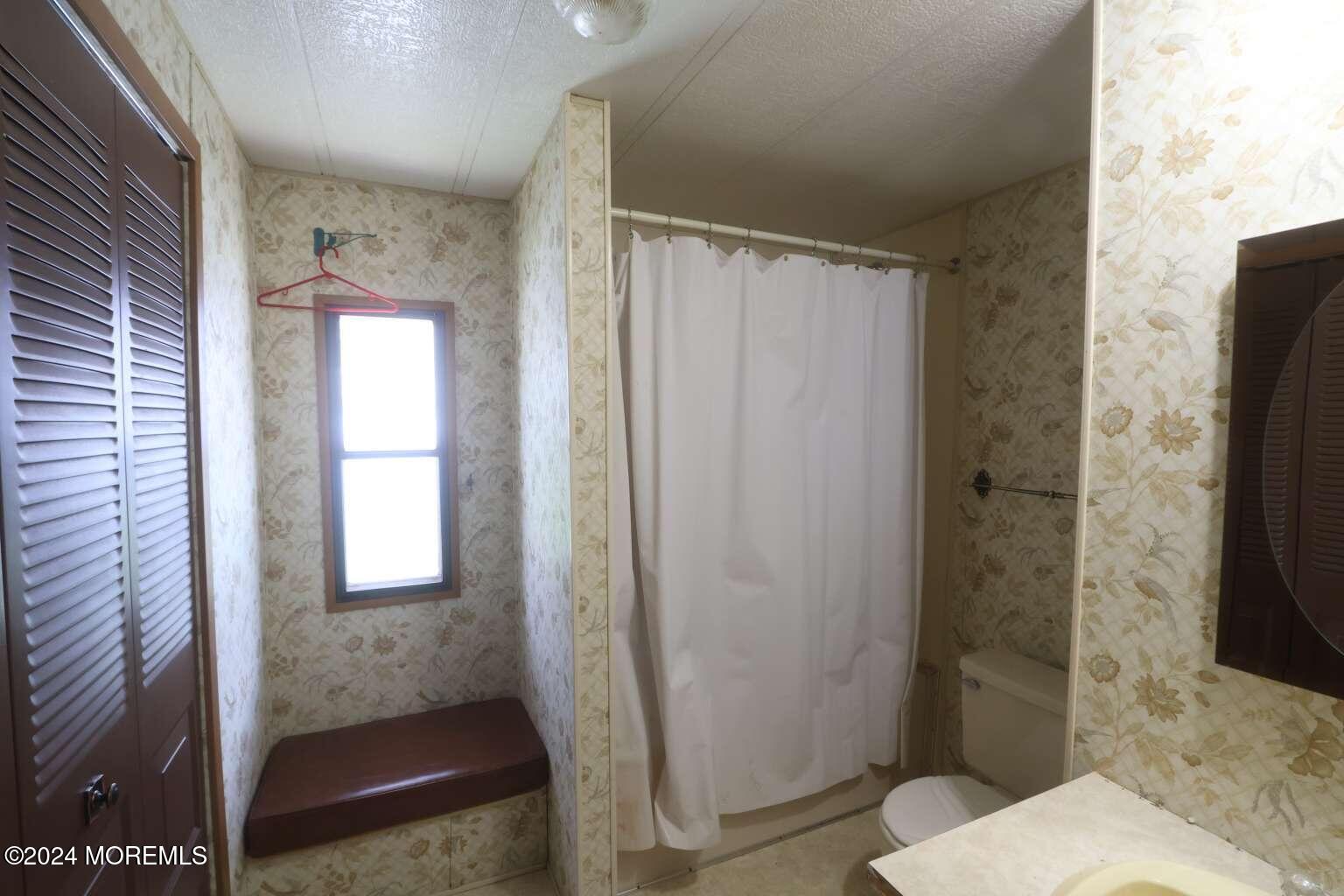 78 Eagle Drive Whiting, NJ 08759 - Photo 24 of 24 a bathroom with a shower and a toilet