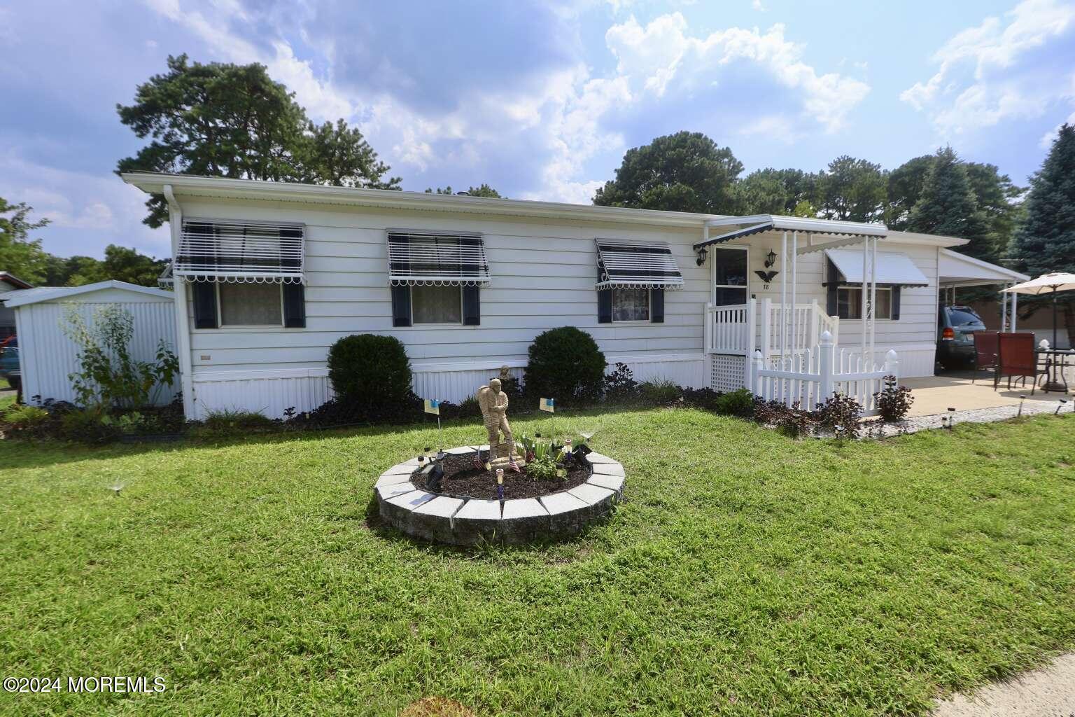 78 Eagle Drive Whiting, NJ 08759 - Photo 4 of 24 a view of a house with a backyard and a garden