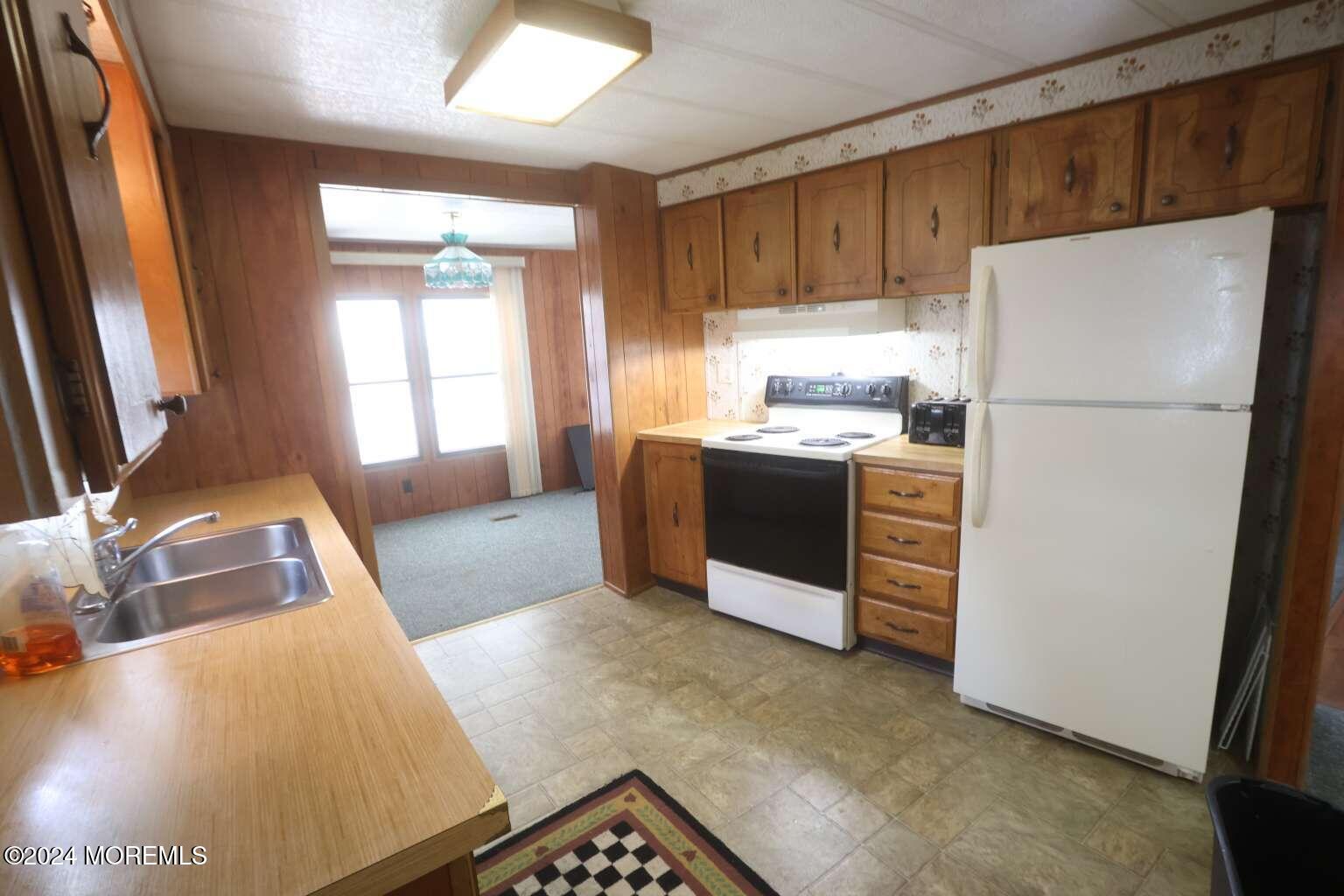 78 Eagle Drive Whiting, NJ 08759 - Photo 6 of 24 a kitchen with stainless steel appliances a refrigerator and a sink