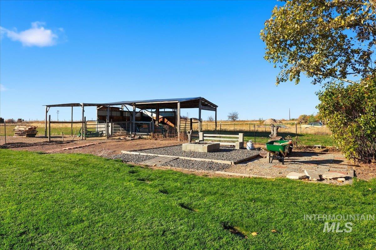 3293 West Twin View Lane Meridian, ID 83642 - Photo 39 of 43 View of yard with an outbuilding and a patio area