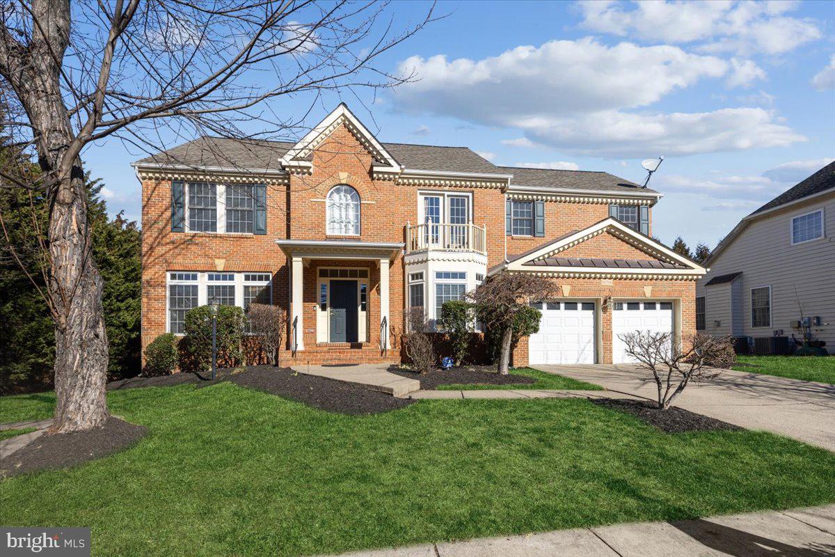 13714 Monet Court Chantilly, VA 20151 - Photo 2 of 58 a front view of a house with a yard