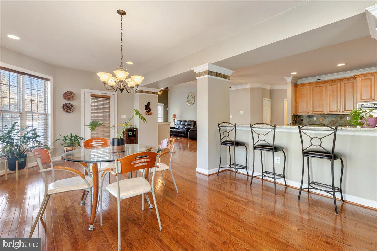 13714 Monet Court Chantilly, VA 20151 - Photo 21 of 58 a view of a dining room with furniture window and wooden floor