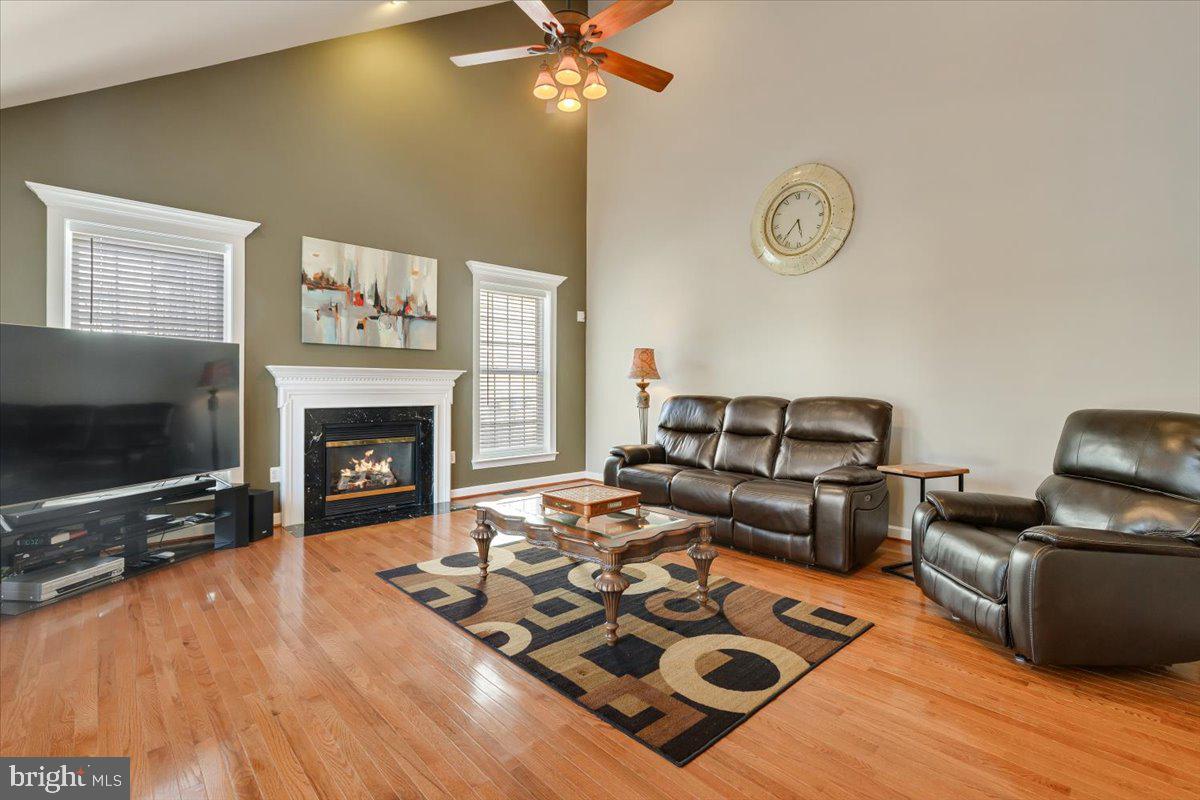 13714 Monet Court Chantilly, VA 20151 - Photo 26 of 58 a living room with furniture and a flat screen tv