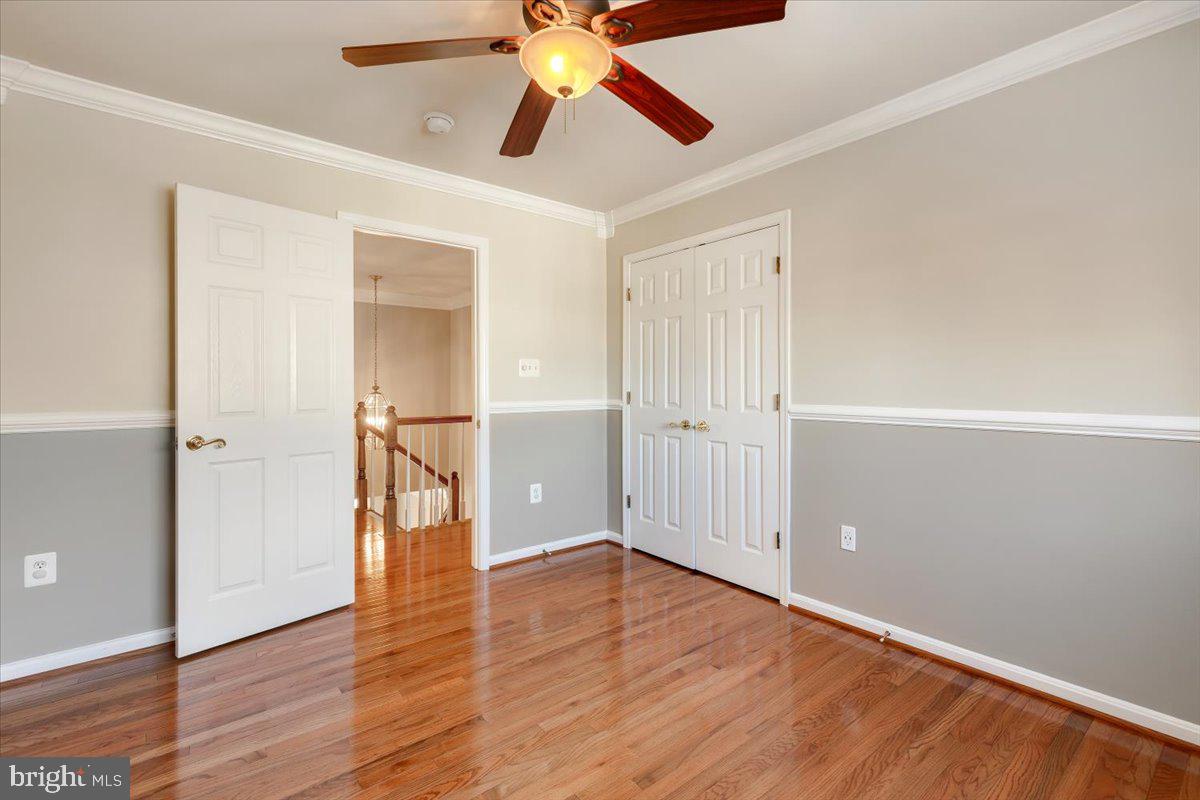 13714 Monet Court Chantilly, VA 20151 - Photo 36 of 58 a view of an empty room and wooden floor