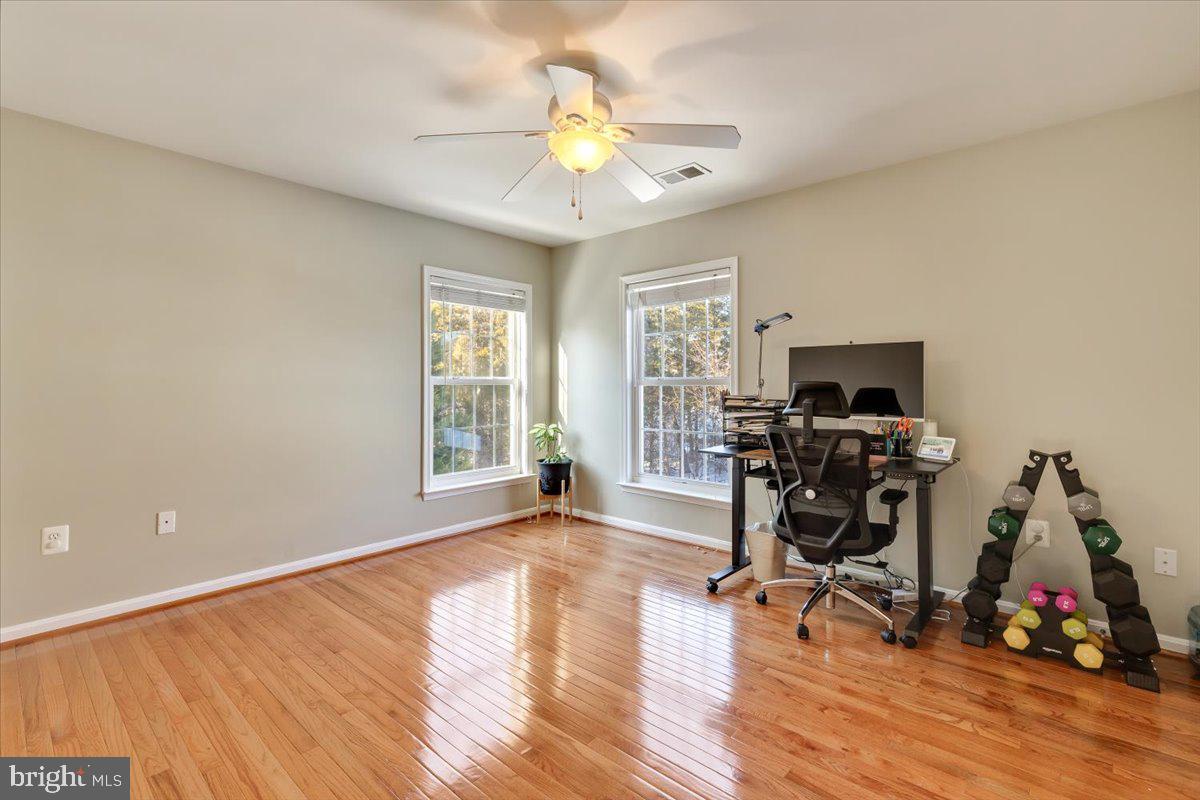 13714 Monet Court Chantilly, VA 20151 - Photo 39 of 58 a view of a workspace with furniture and a window