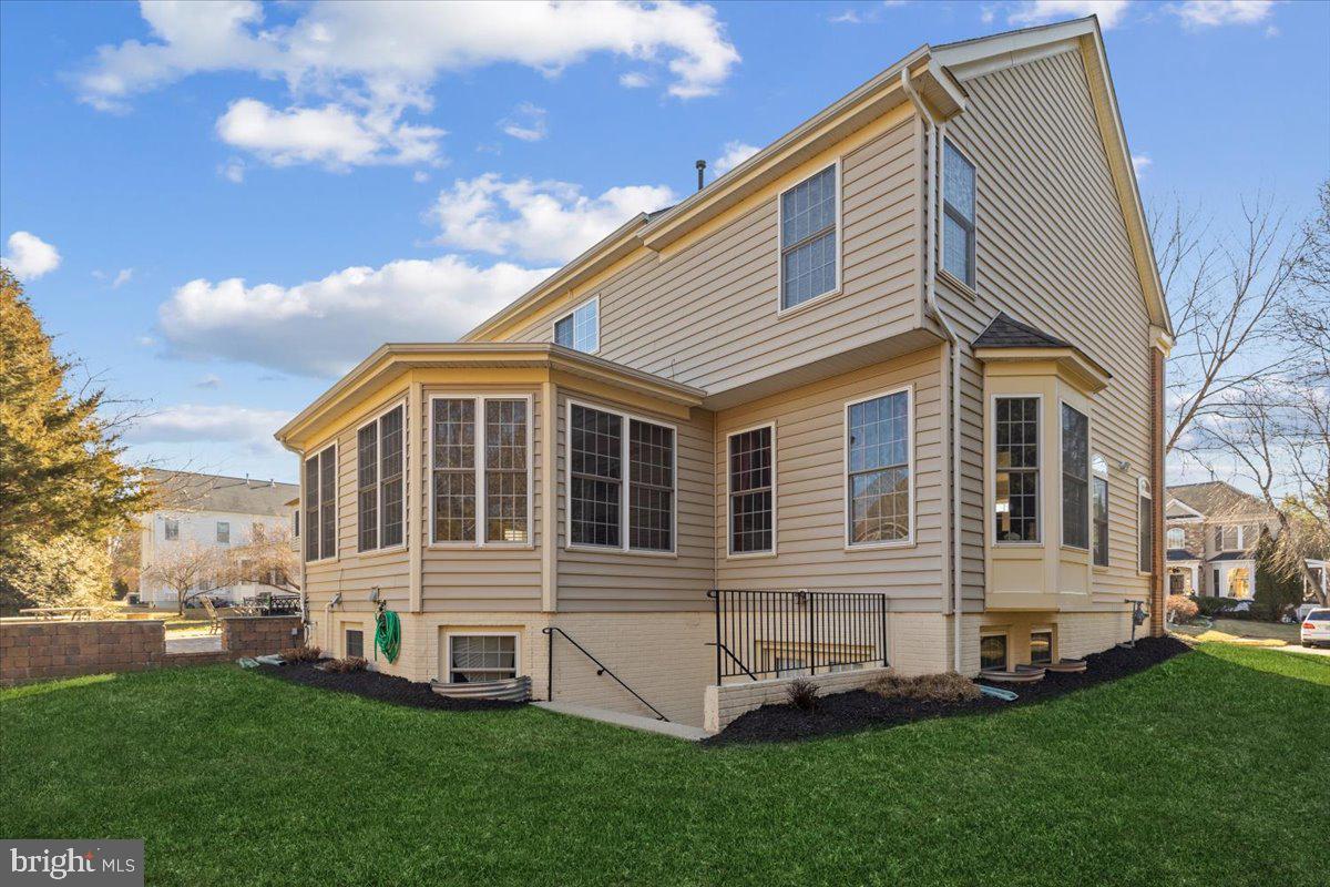 13714 Monet Court Chantilly, VA 20151 - Photo 4 of 58 a view of a house with a yard