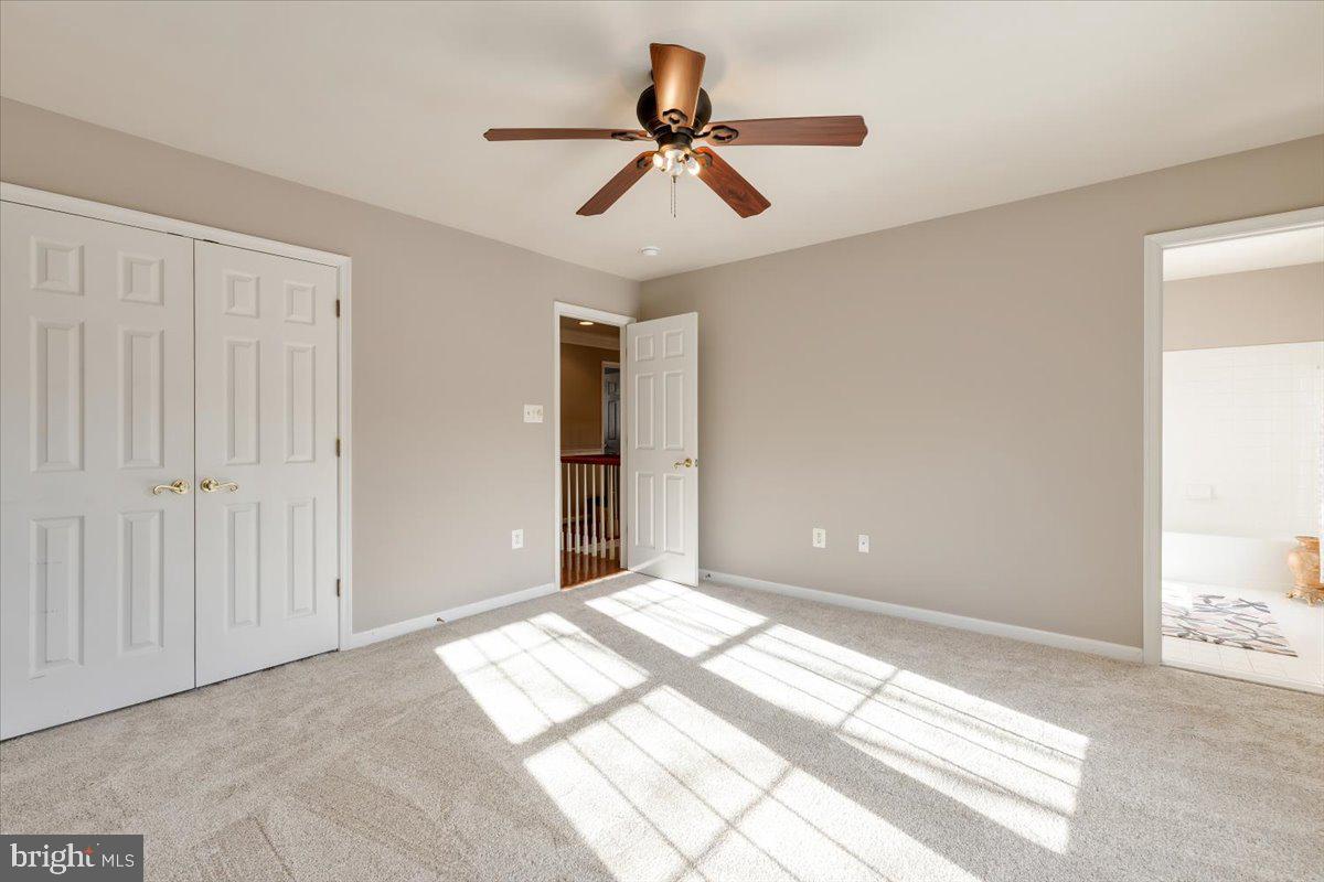 13714 Monet Court Chantilly, VA 20151 - Photo 41 of 58 a view of a room with a ceiling fan