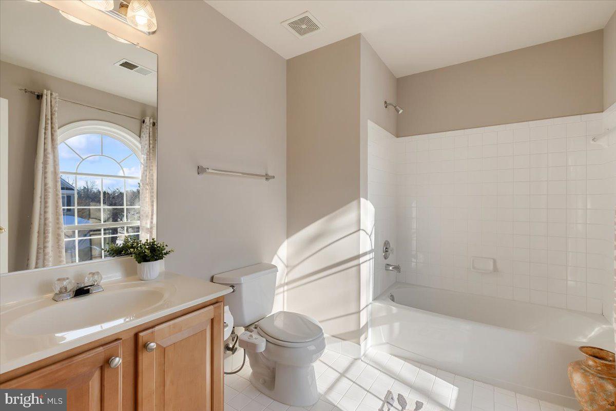 13714 Monet Court Chantilly, VA 20151 - Photo 44 of 58 a bathroom with a sink toilet and shower