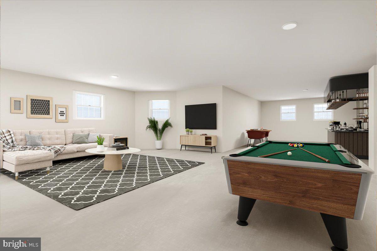 13714 Monet Court Chantilly, VA 20151 - Photo 47 of 58 a living room with furniture and a flat screen tv