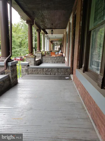 a view of living room with furniture and floor to ceiling window
