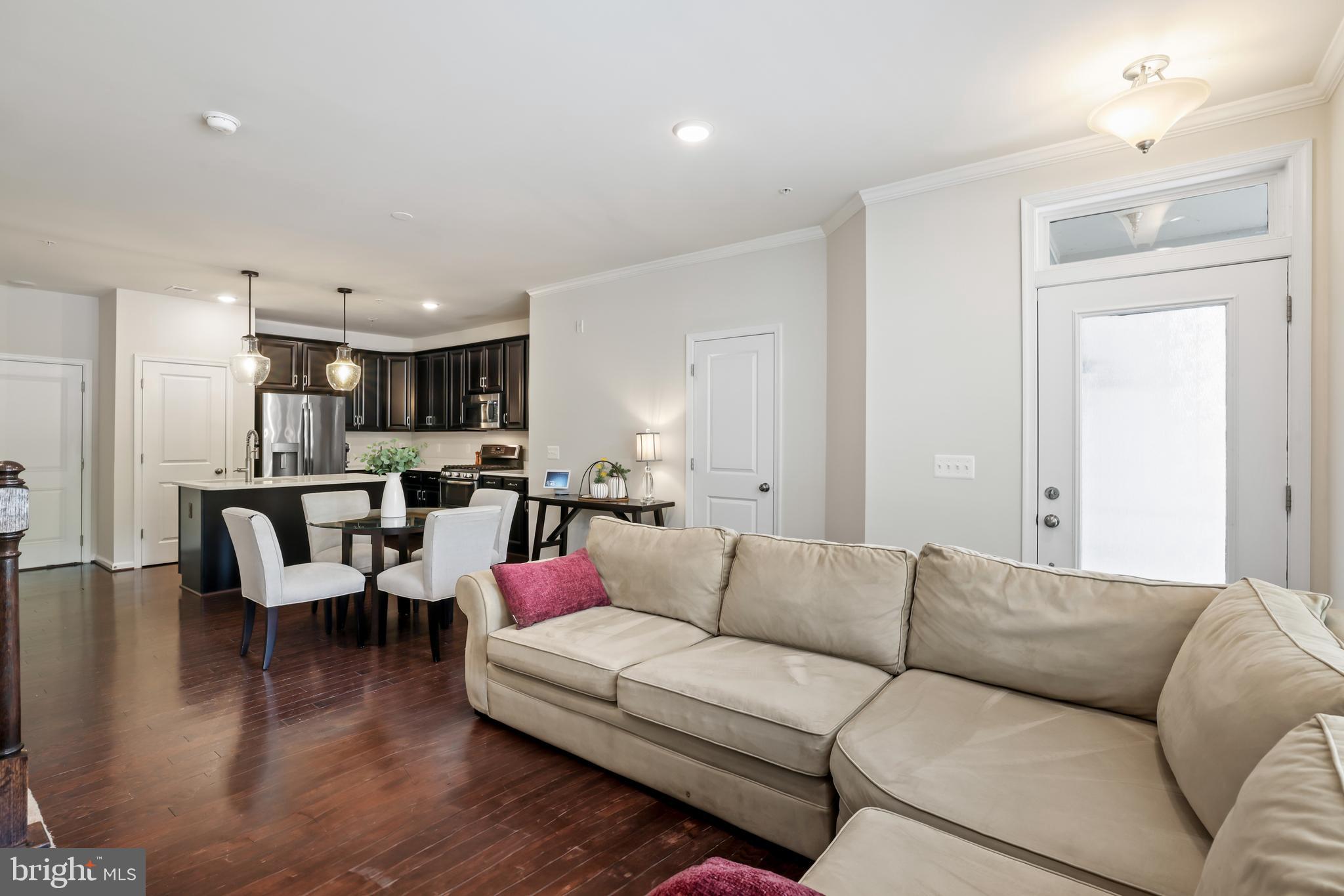 1102 Ribbon Limestone Terrace Southeast Leesburg, VA 20175 - Photo 19 of 51 a living room with furniture and kitchen view
