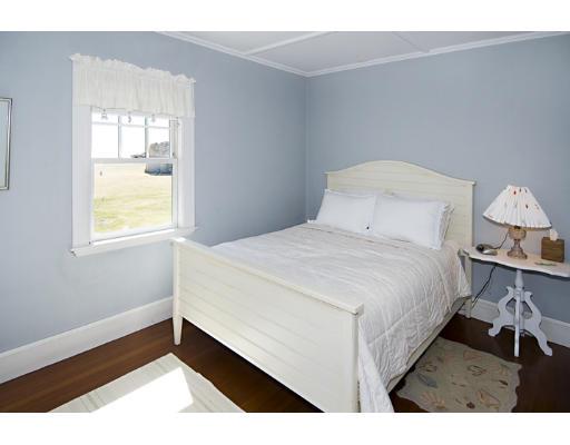 214 Atlantic Road Gloucester, MA 01930 - Photo 16 of 30 a bedroom with a bed and a window