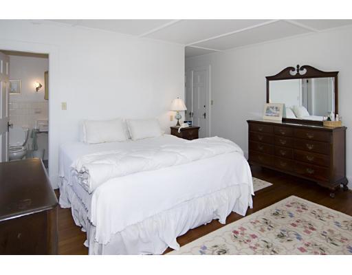 214 Atlantic Road Gloucester, MA 01930 - Photo 17 of 30 a bedroom with a bed and a dresser