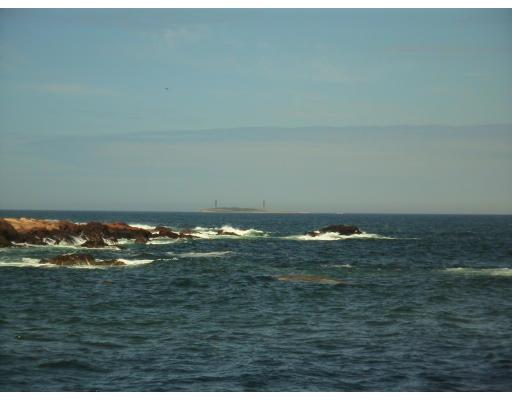 214 Atlantic Road Gloucester, MA 01930 - Photo 4 of 30 a close up of a table and an ocean