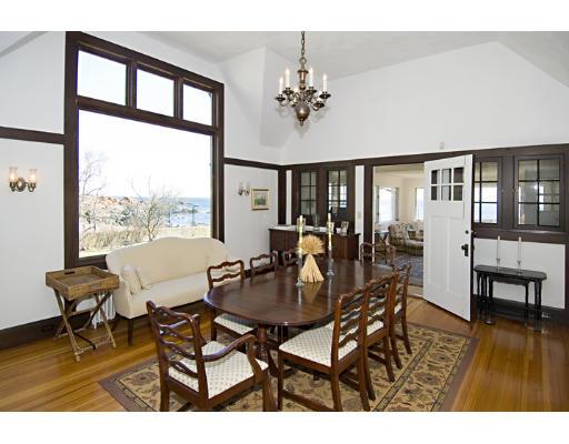 214 Atlantic Road Gloucester, MA 01930 - Photo 9 of 30 a view of a dining room with furniture a chandelier and wooden floor